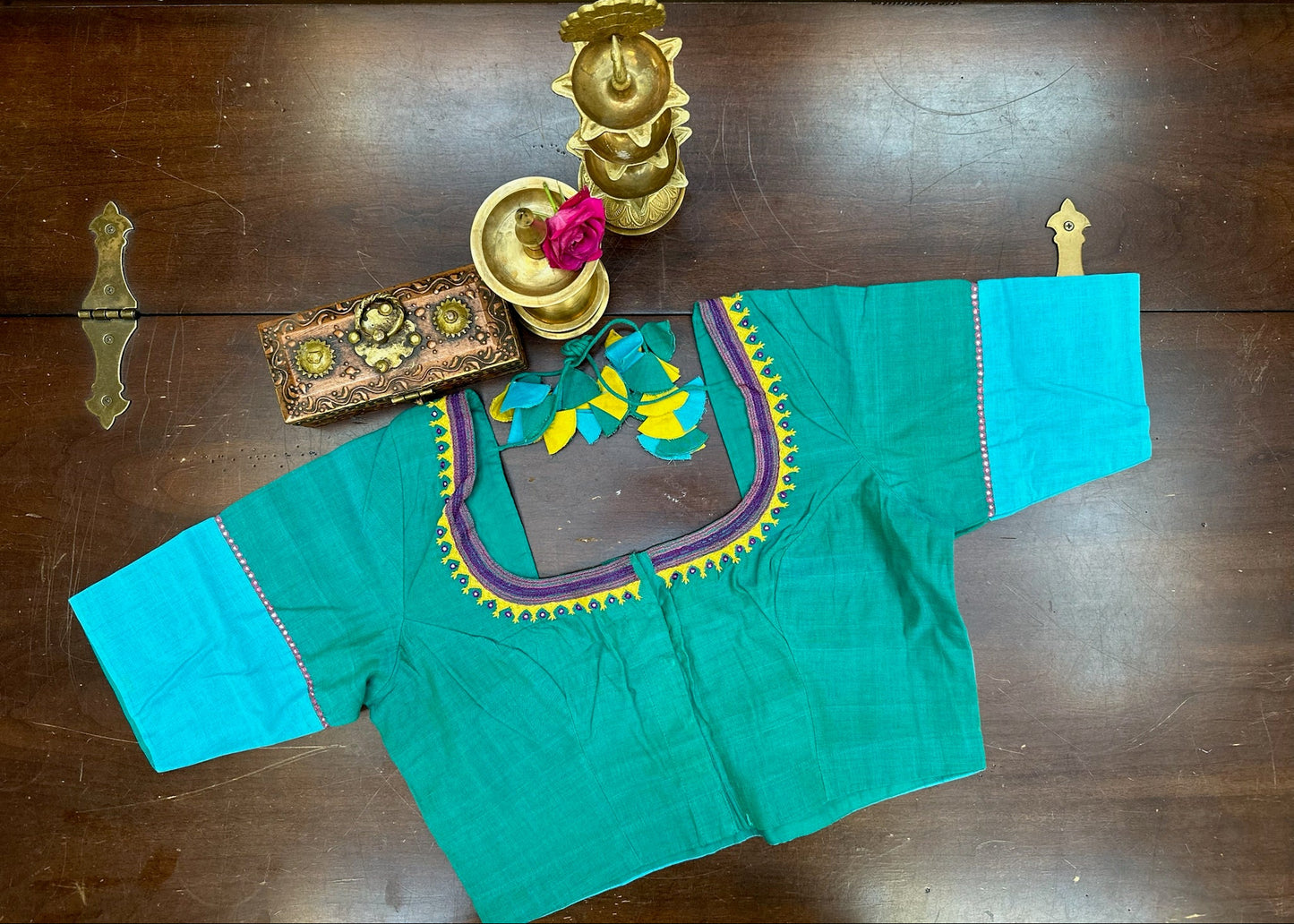 Teal blouse with colorful embroidery