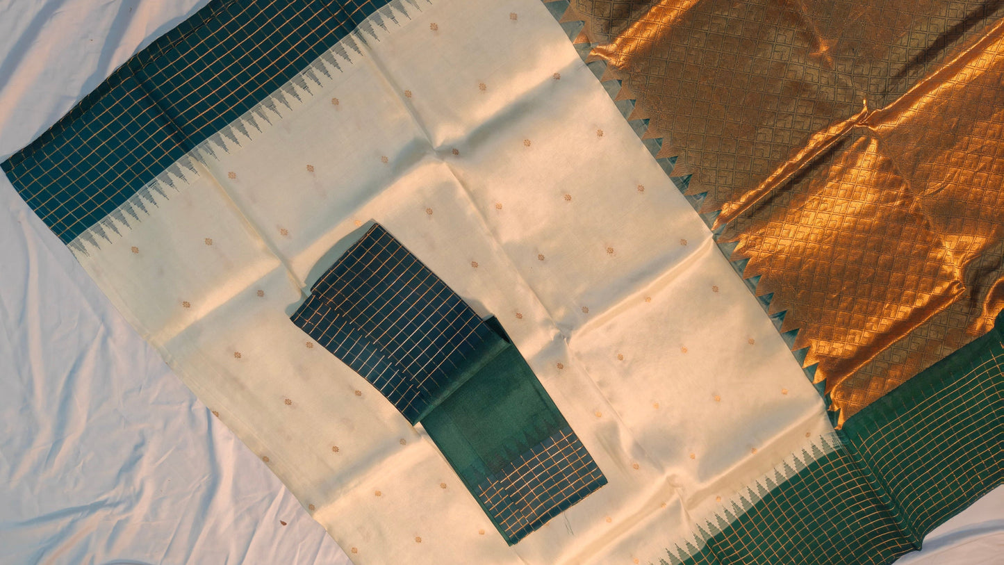 Close-up of a quilt with gold and green patterns on a white background