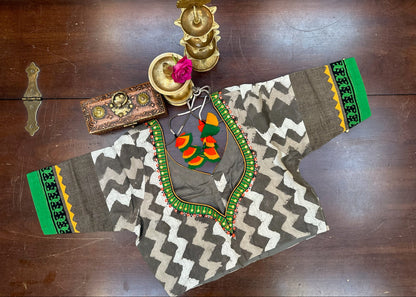 Traditional embroidered garment with geometric patterns